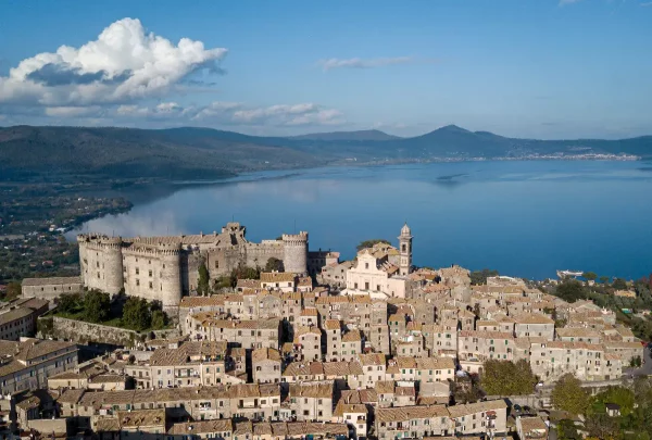 Aerial view of Bracciano city with the picturesque Bracciano Lake in the background showcasing the charm of this Italian destination