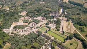 Aerial View of Villa Adriana Scoot around Rome n aerial view of Villa Adriana showcasing expansive Roman ruins with various structures gardens and pools surrounded by greenery