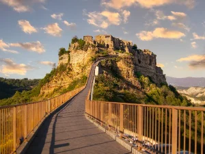 Civita di Bagnoregio 天空之城 Tour a day trip from rome to Timeless Beauty Scoot around Rome Breathtaking view of Civita di Bagnoregio 天空之城 from the middle of the bridge capturing the essence of this charming Italian village