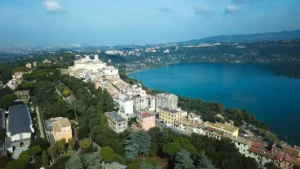 Aerial panoramic view of Castel Gandolfo village with Lake Albano in the background showcasing the beauty of this historic town near Rome
