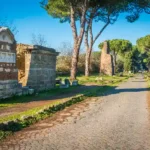 Scenic view of Via Appia Antica with Tomba di Ilario Fusco, an ancient Roman tomb along the historic road