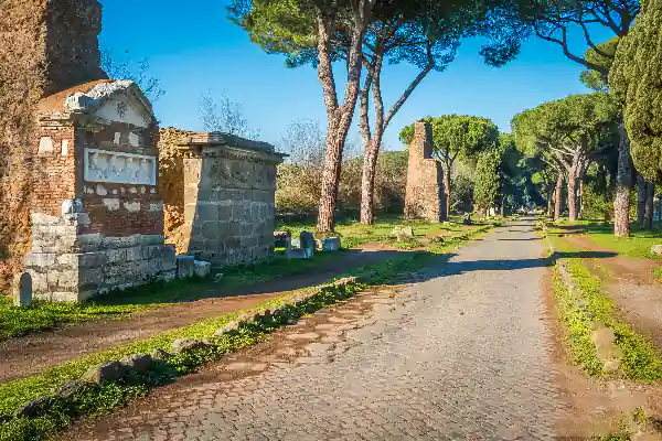 Scenic view of Via Appia Antica with Tomba di Ilario Fusco, an ancient Roman tomb along the historic road