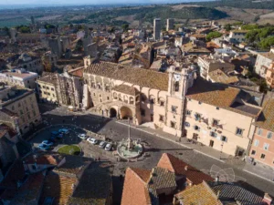 Aerial View of Tarquinias Main Square Scoot around Rome Drone view of the main square of Tarquinia showing historic buildings and town layout from above