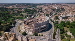 Drone view of the Colosseum and Romes downtown capturing iconic landmarks and the cityscape